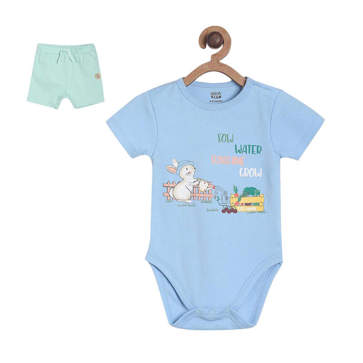 Blue Bodysuit With Growing Own Veg Graphic Paired With Pastel Green Knit Shorts